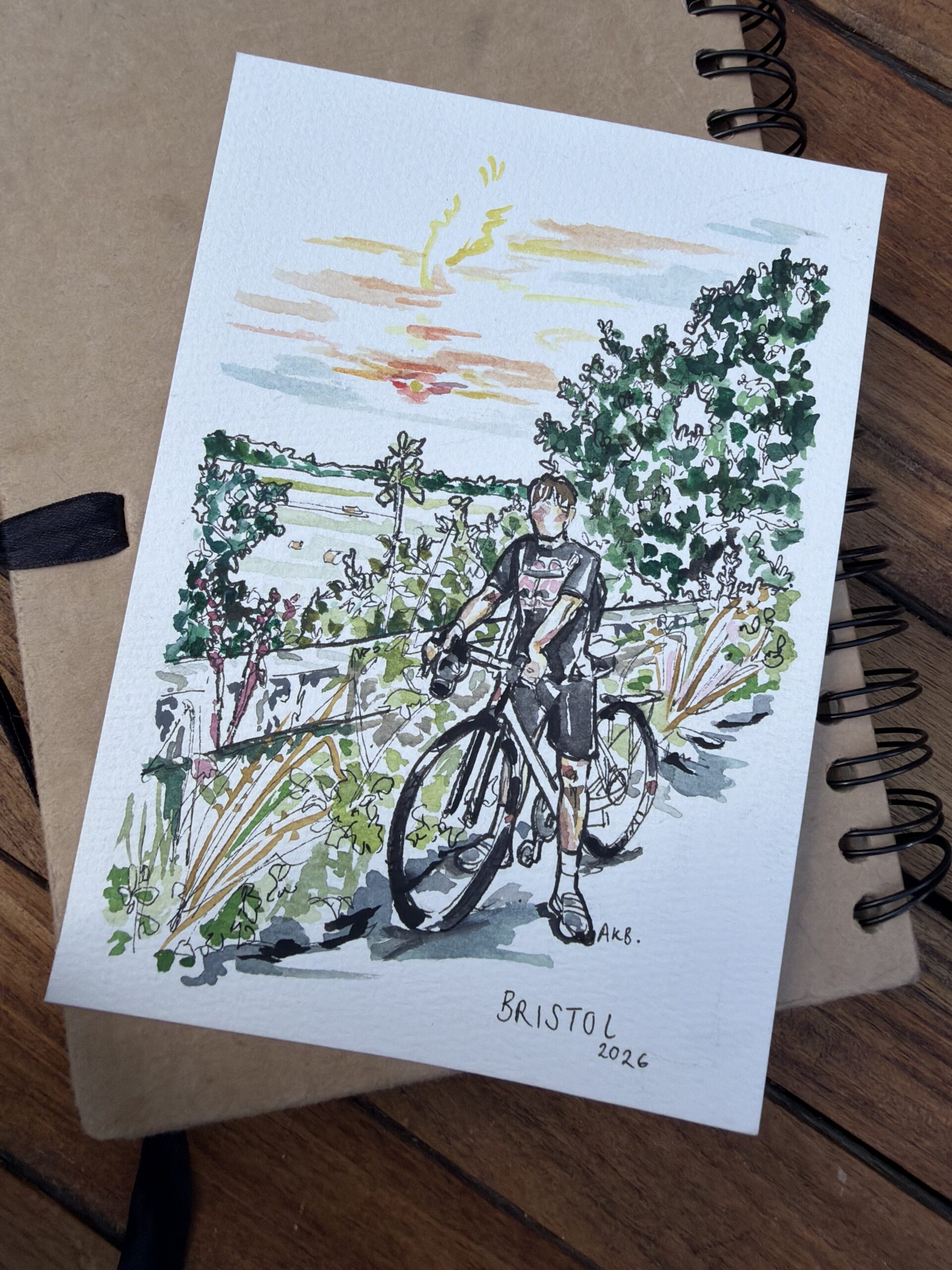 Watercolour and ink illustration of a cyclist in a lush Bristol garden